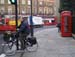 Russell Square man, bicycle, double decker nd call box