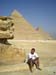 French guy sitting by a Pyramid